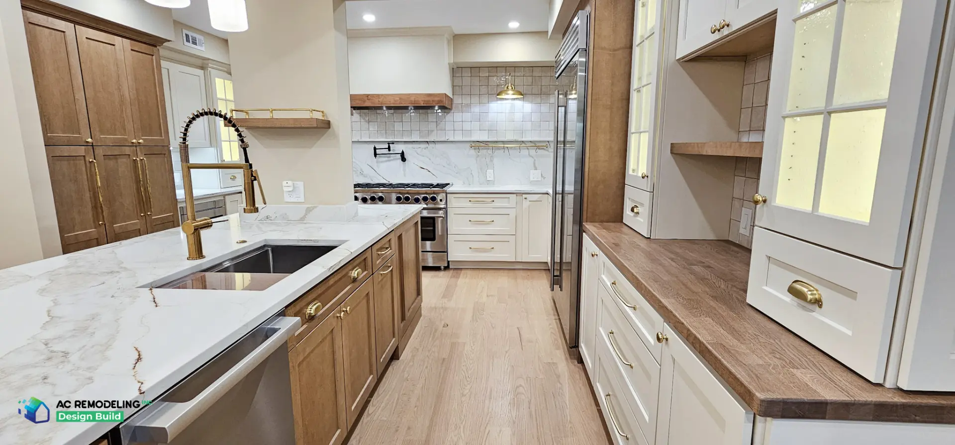 Galley view toward pro range with white oak floors and wood countertop hutch