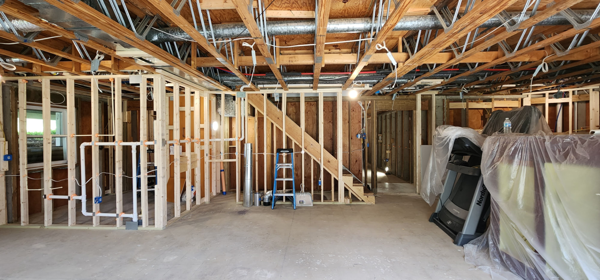 Rockville in-law suite basement during framing, plumbing and mechanical rough-in