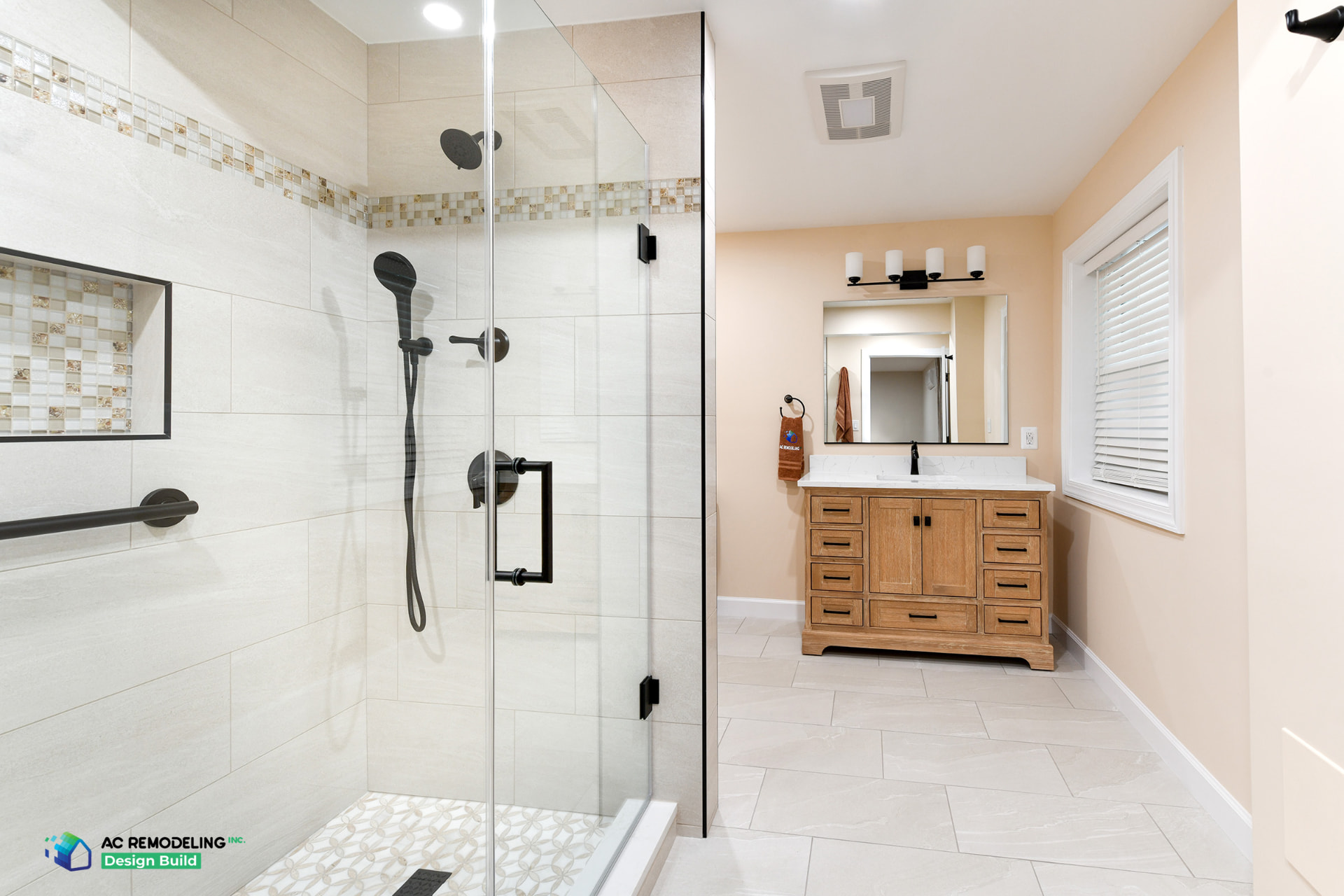 Rockville basement suite bathroom with frameless walk-in shower, grab bars and wood vanity