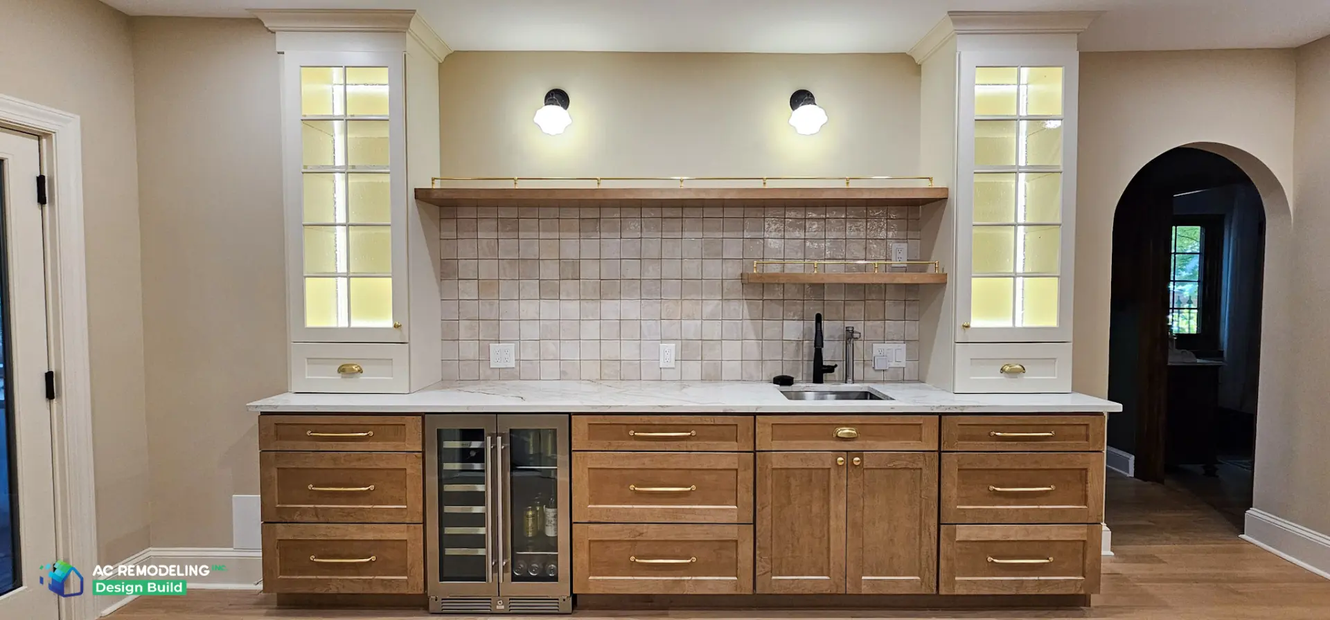 Beverage bar with stained wood cabinetry, wine fridge and glass display cabinets