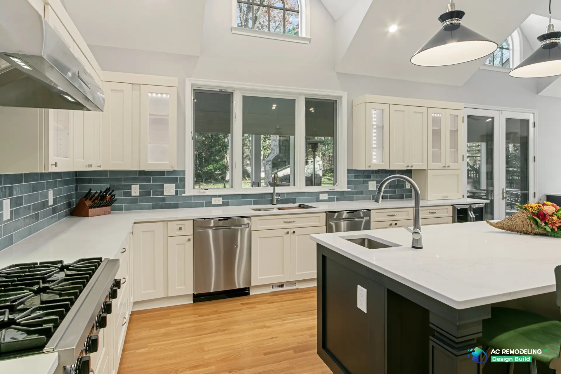 Range wall and window sink run with dual dishwashers and the island prep sink