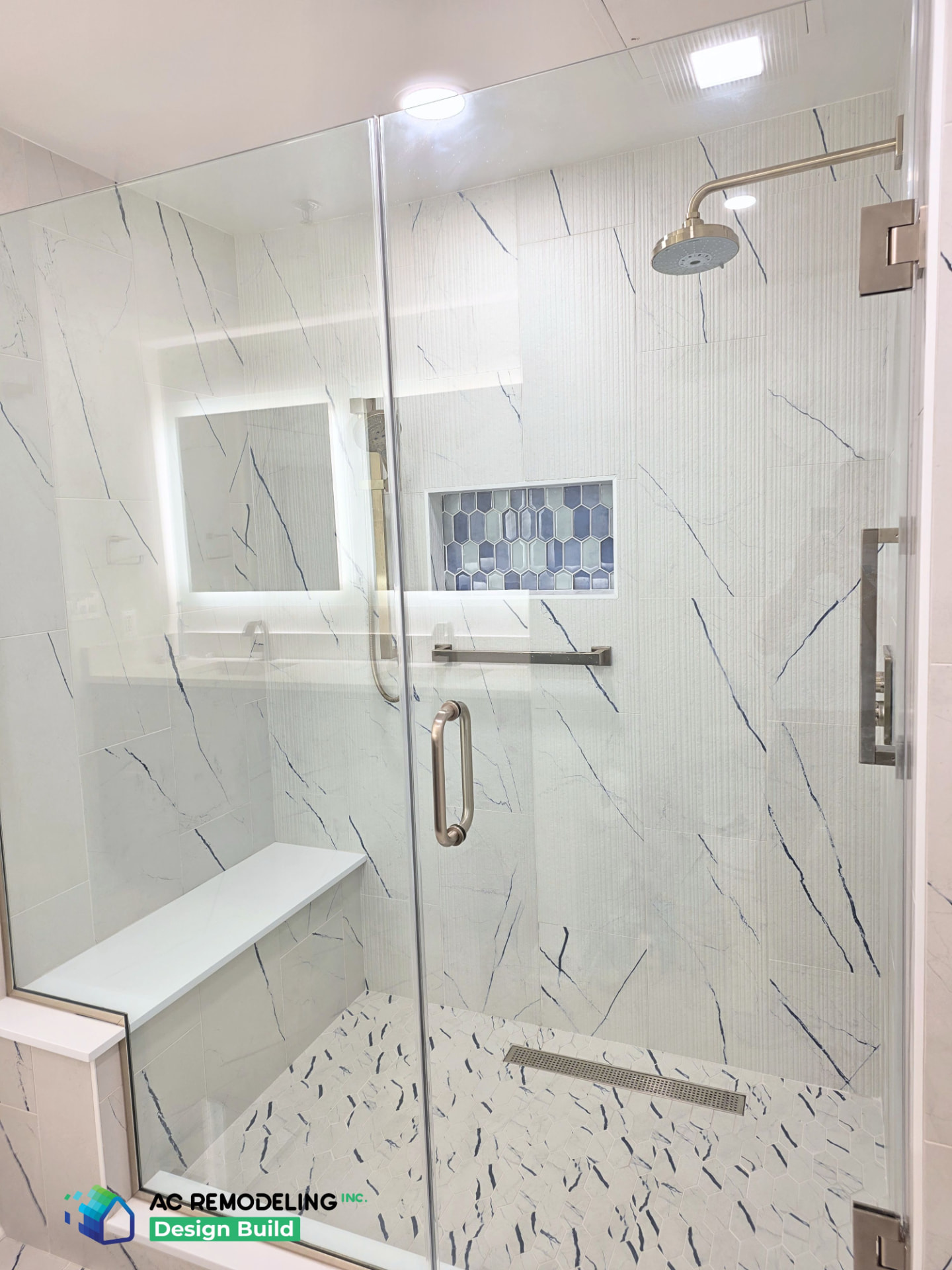 Shower interior with rain head, blue picket niche and quartz bench