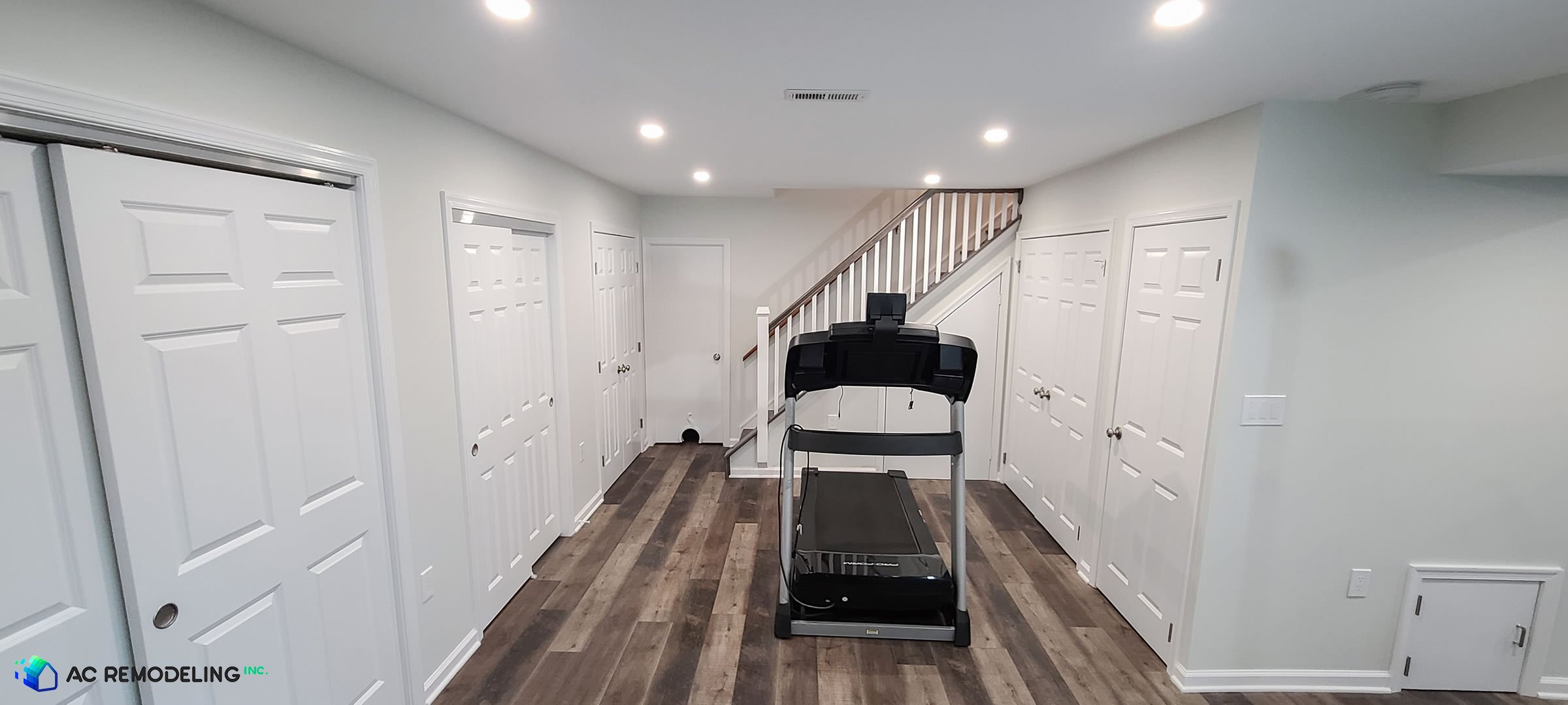 3d rendering of basement renovation idea with kids play area and home gym with treadmill