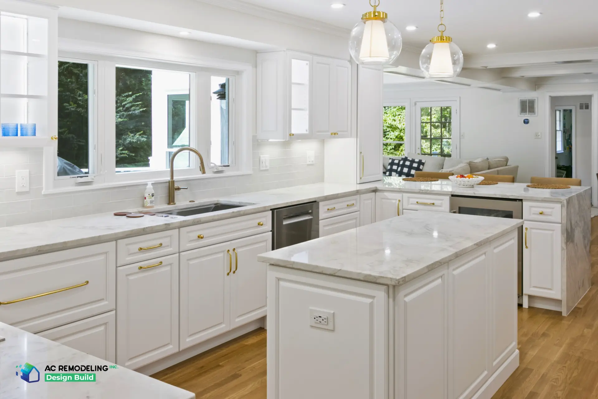 Kitchen sink wall with casement windows opening to family room seating