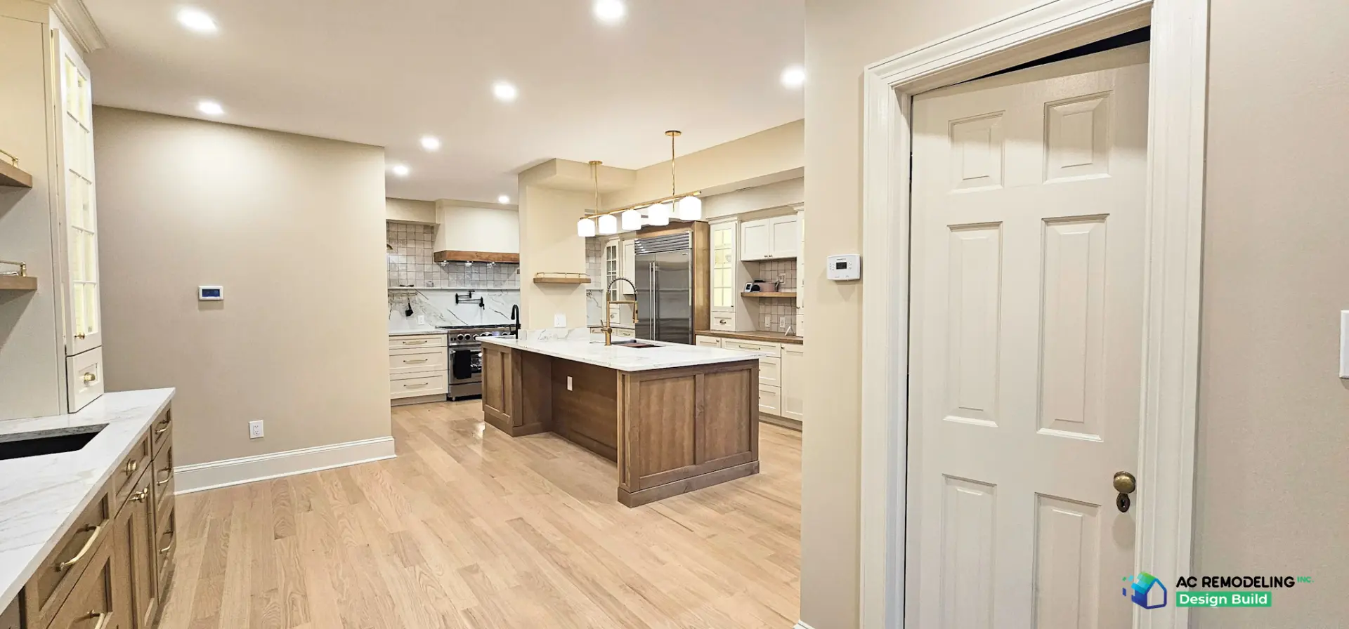 Open sightline from the bar through the kitchen to the stained wood island