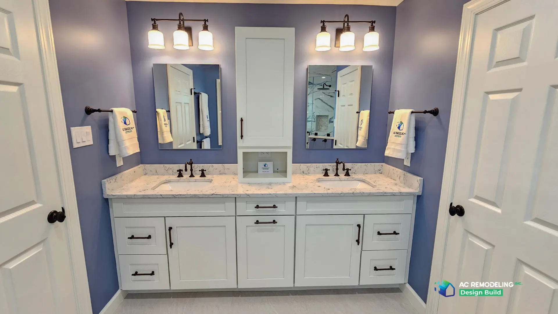 Periwinkle primary bath with white shaker double vanity, marble-look quartz counter and oil-rubbed bronze fixtures