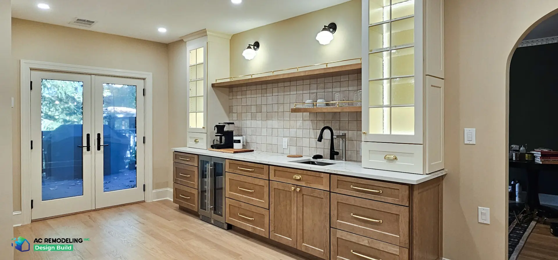 Beverage and coffee bar with stained wood cabinetry, wine fridge and brass rail